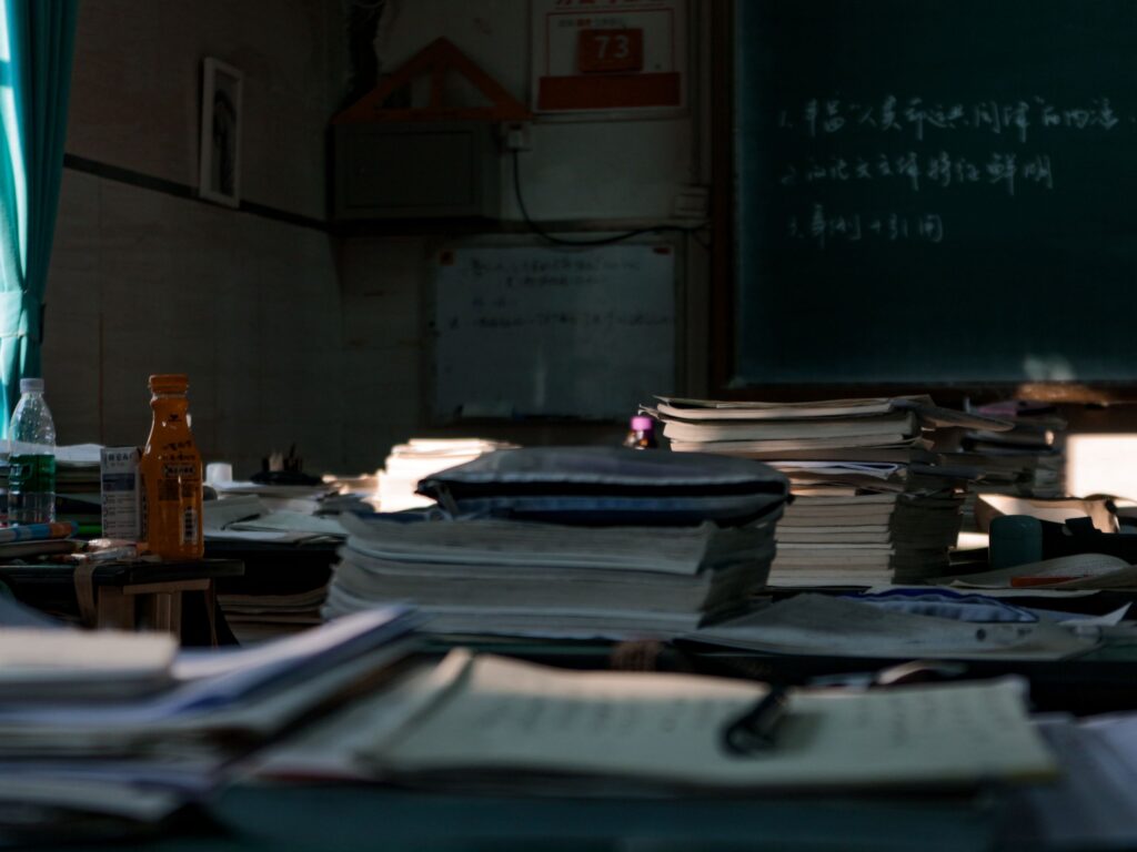 Stacks of papers and documents piled on office desks